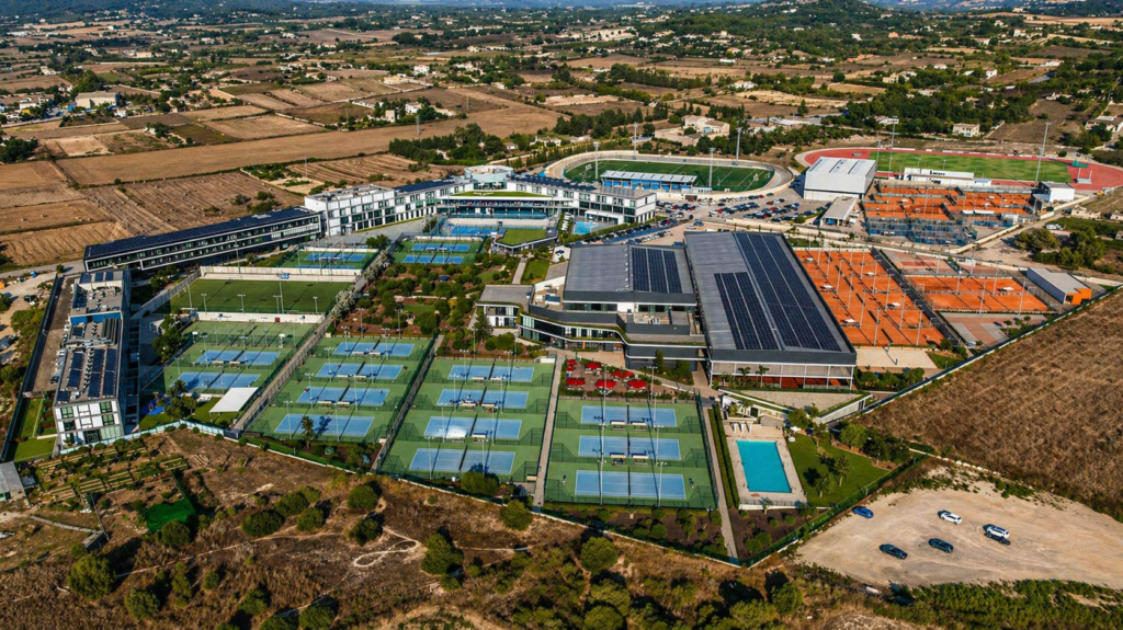 Aerial view of the Rafa Nadal Academy in Mallorca with multiple tennis courts and training facilities